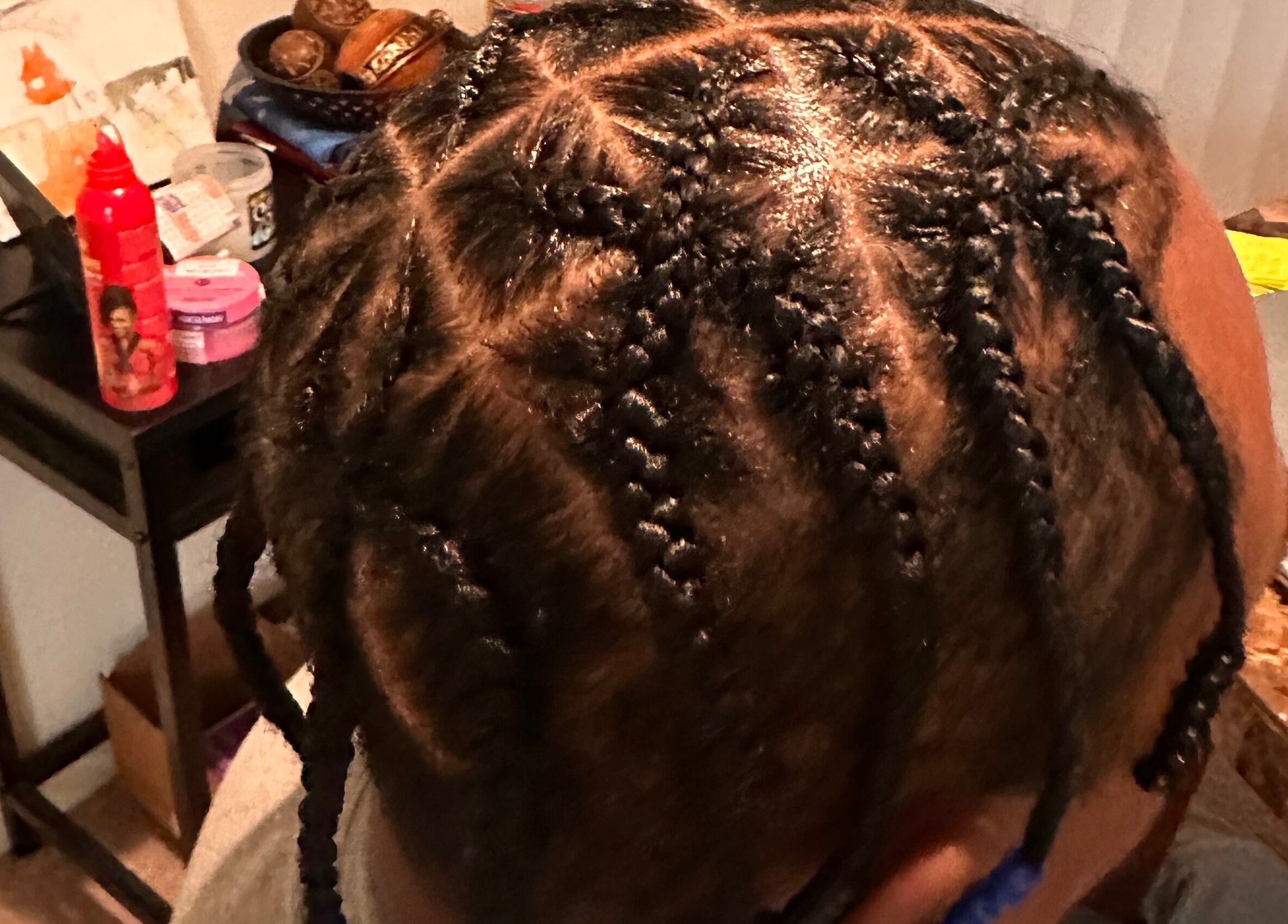 Intricate braids styled at Natural Braids By Val in Indianapolis, Indiana, US.