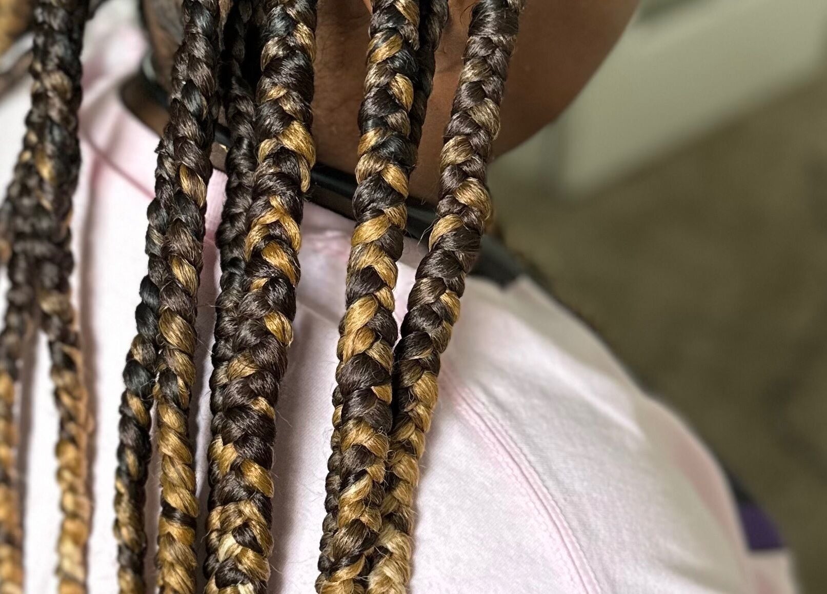 Close-up of intricate braids at Natural Braids By Val in Indianapolis, Indiana, US, showcasing vibrant styles.