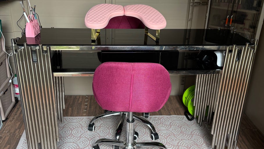 Smwsh Nail Care Services in Cardiff, Wales, offers a stylish pink and black nail station for exceptional care.