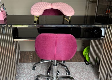 Smwsh Nail Care Services in Cardiff, Wales, offers a stylish pink and black nail station for exceptional care.