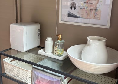 Modern setup at Smwsh Nail Care Services in Cardiff, Wales, GB with a sleek table and beauty products.