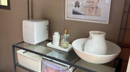 Modern setup at Smwsh Nail Care Services in Cardiff, Wales, GB with a sleek table and beauty products.