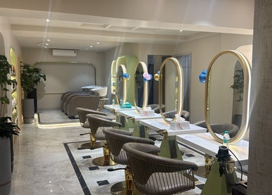 Luxury interior of Ruva salon in Mumbai, Maharashtra, IN featuring chic styling stations and mirrors.
