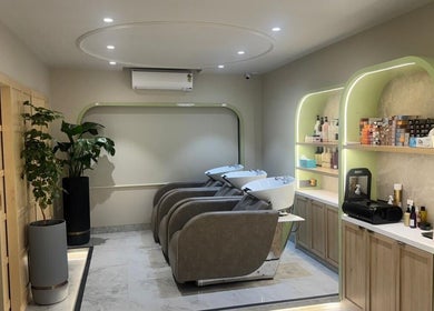 Luxurious salon interior at Ruva, Mumbai, Maharashtra, IN featuring modern wash stations and stylish decor.