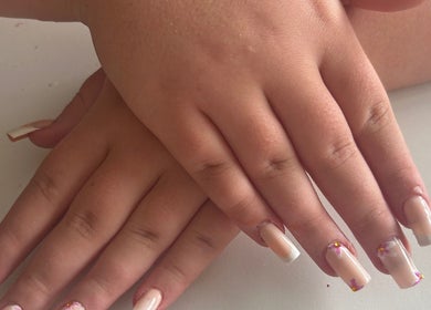 Manicured hands with artistic nails at Gloss by Lexie, Shenstone, England, GB.