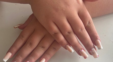Manicured hands with artistic nails at Gloss by Lexie, Shenstone, England, GB.