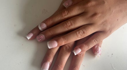 Elegant French manicure with floral designs at Gloss by Lexie, Shenstone, England, GB.