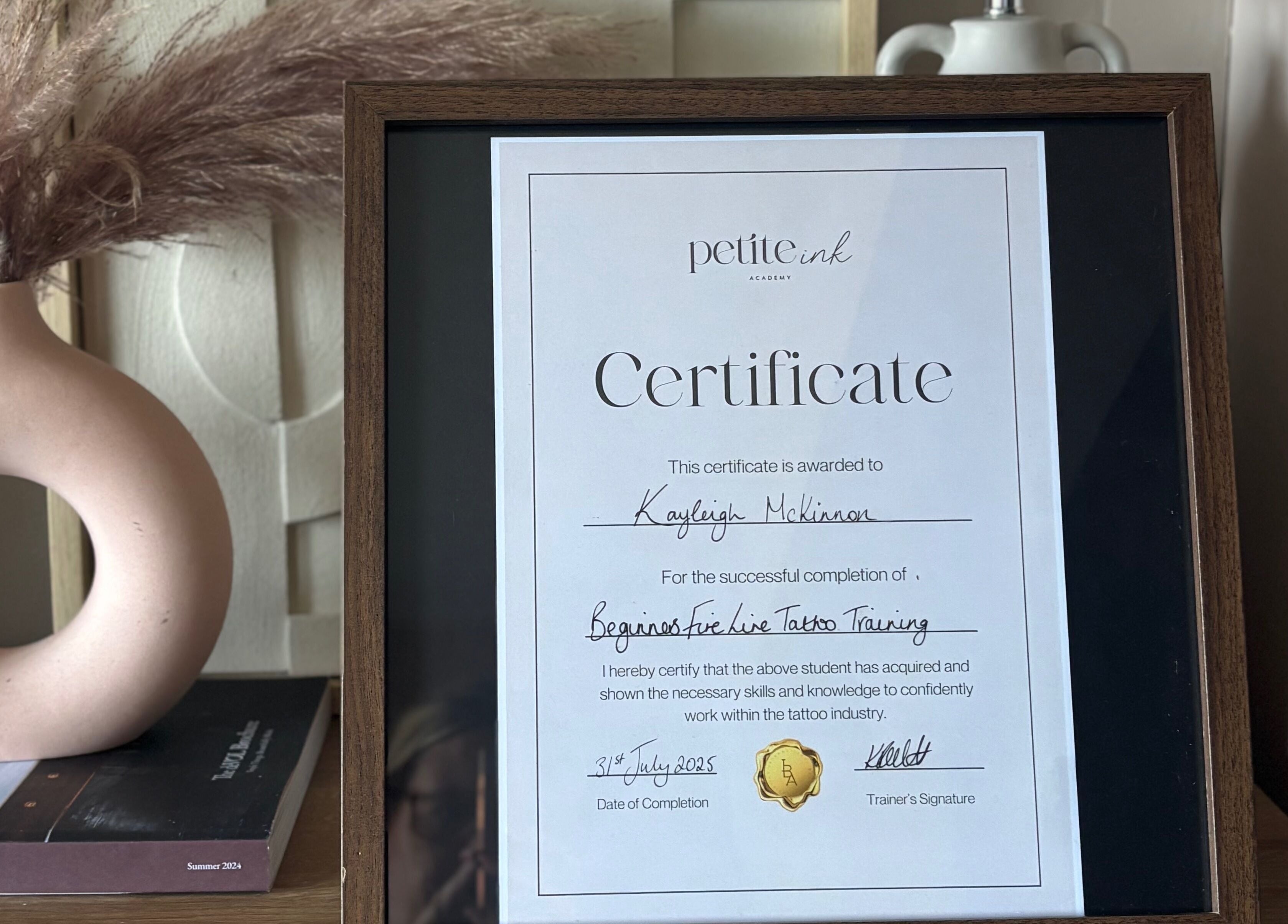 Certificate on display at Pristine Ink, Brentwood, England, GB, highlighting training completion success.