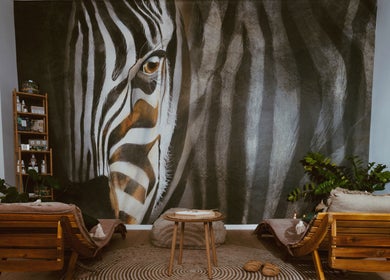 Tranquil lounge at INARI SPA in București, 1, RO with zebra-themed art creating a serene ambiance.