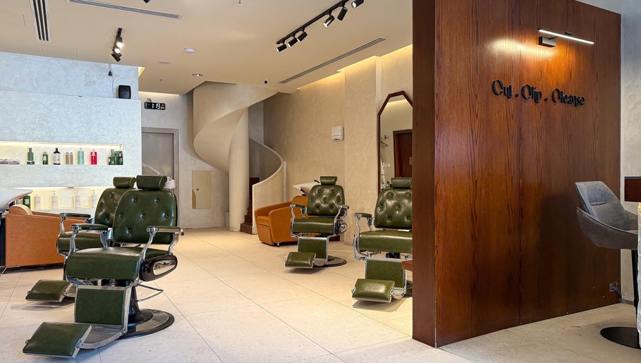 Elegant interior of Capelli Boutique barbershop, Al Khobar, Eastern Province, SA, featuring plush chairs and a stylish atmosphere.
