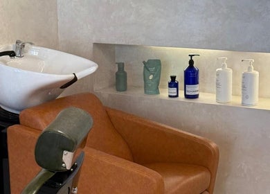 Modern salon chair and sink setup at Capelli Boutique barbershop, Al Khobar, Eastern Province, SA.