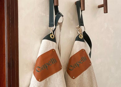 Designer aprons hanging at Capelli Boutique Barbershop, Al Khobar, Eastern Province, SA.