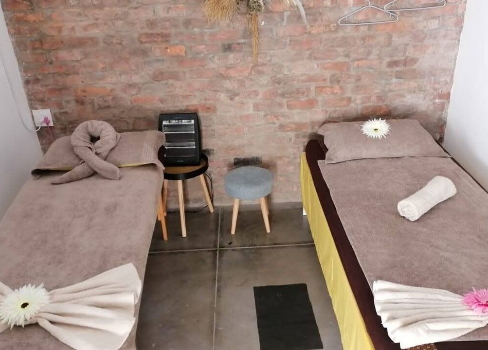 Cozy massage beds at Ubuhle Health and Wellness Spa, Jeffreys Bay, Eastern Cape, ZA with serene decor.