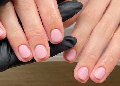 Manicured hands with light pink polish at Serene Mani’s in Stevenage, England, GB.
