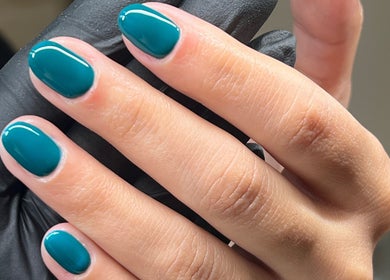 Close-up of polished teal nails at Serene Mani's, Stevenage, England, GB, showcasing expert manicure.