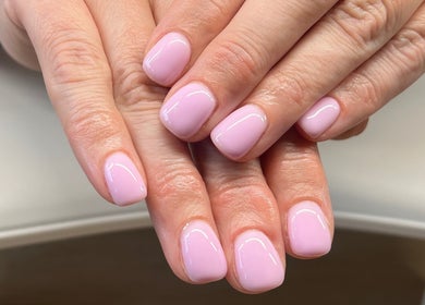 Elegant pink manicured nails at Serene Mani’s in Stevenage, England, GB, showcasing professional nail artistry.