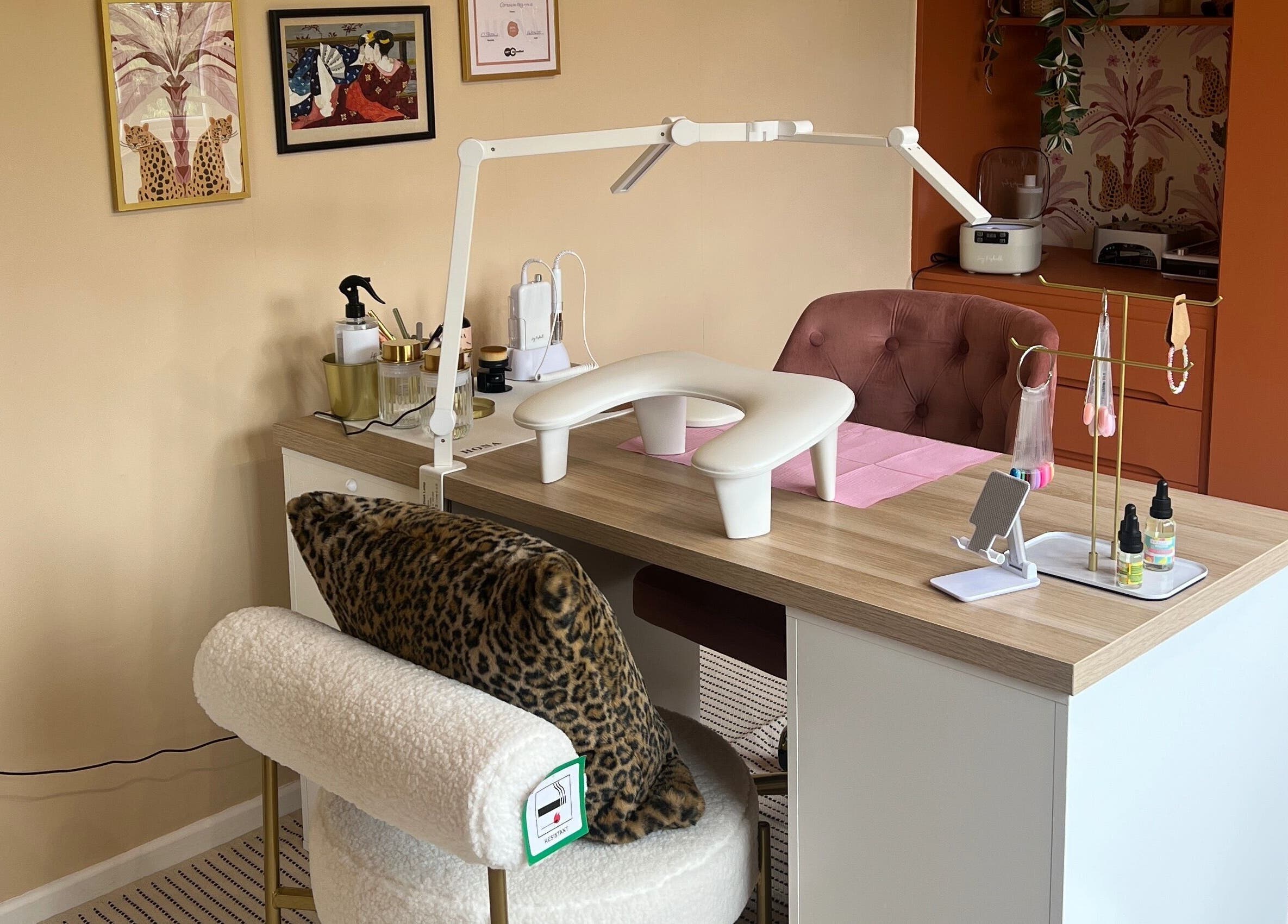 Elegant nail workspace at Serene Mani’s, Stevenage, England, GB, showcasing stylish decor and comfy seating.