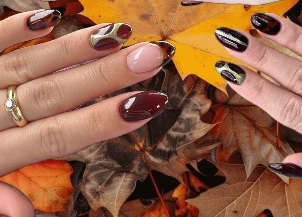 Elegant fall nail art at Serene Mani’s in Stevenage, England, GB, showcasing rich autumn colors and designs.