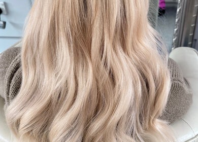 Beautiful wavy blonde hair styled at Extensionsbyalyx in Edinburgh, Scotland, GB.