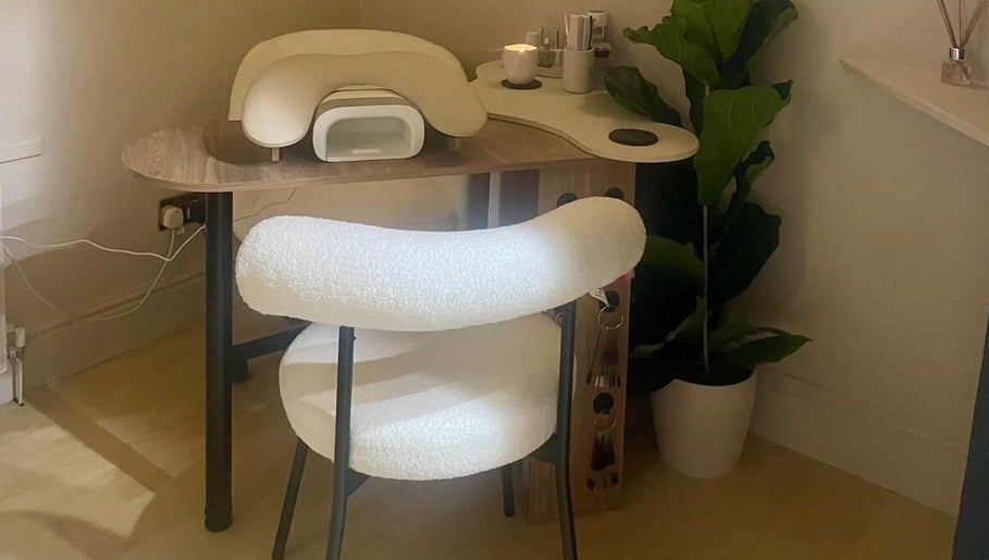 Manicure desk and chair at Bare. Beauty Studio in Bradford, England, GB. A cozy and stylish setup.