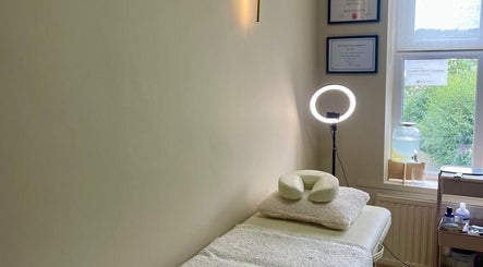 Tranquil treatment room at Bare. Beauty Studio in Bradford, England, GB with soft lighting and cozy decor.