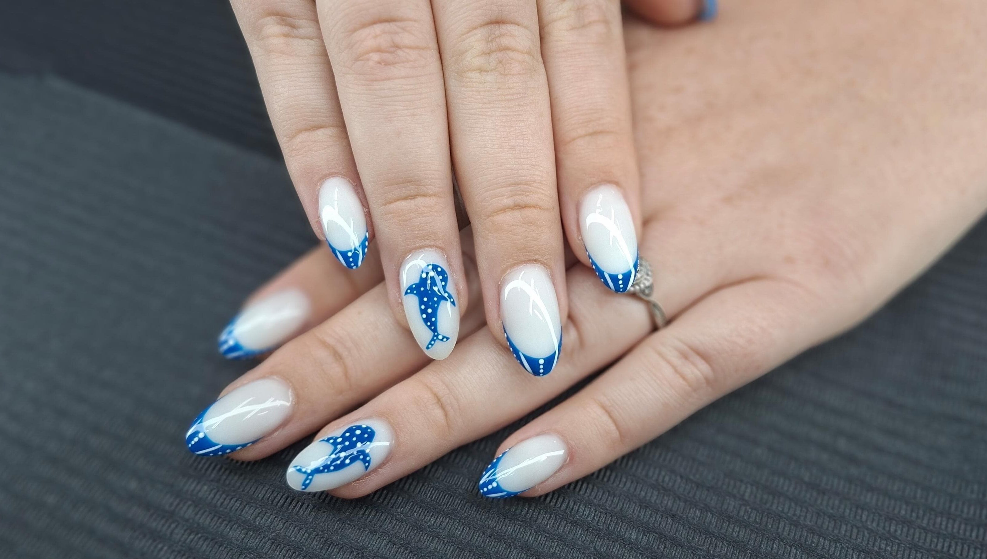 Stylish blue dolphin nail art at Mudnmilk nails and beauty, Emanzimtoti, Kwazulu-natal, ZA.