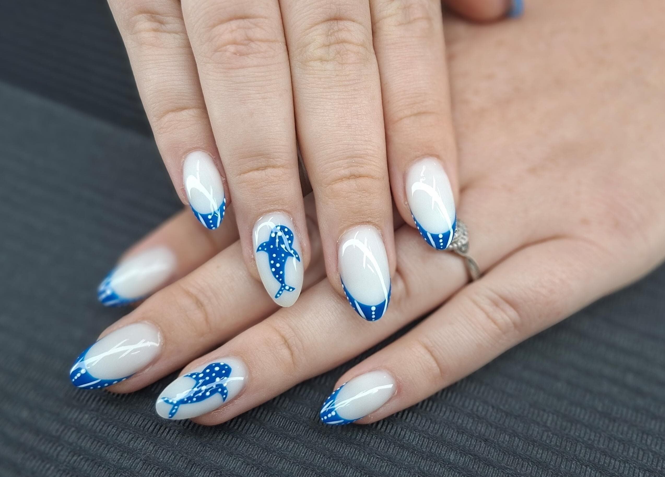 Stylish blue dolphin nail art at Mudnmilk nails and beauty, Emanzimtoti, Kwazulu-natal, ZA.