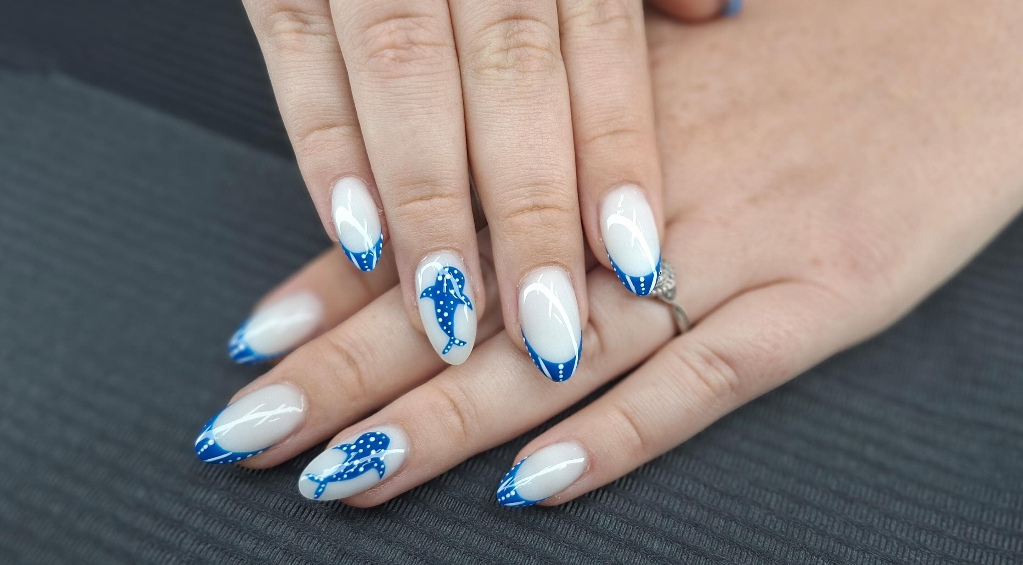 Stylish blue dolphin nail art at Mudnmilk nails and beauty, Emanzimtoti, Kwazulu-natal, ZA.