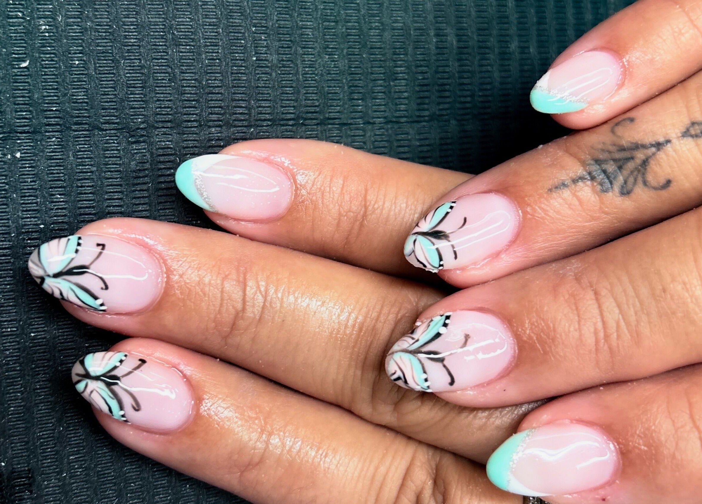 Elegant nail art with butterfly design at Mudnmilk nails and beauty, Emanzimtoti, Kwazulu-natal, ZA.