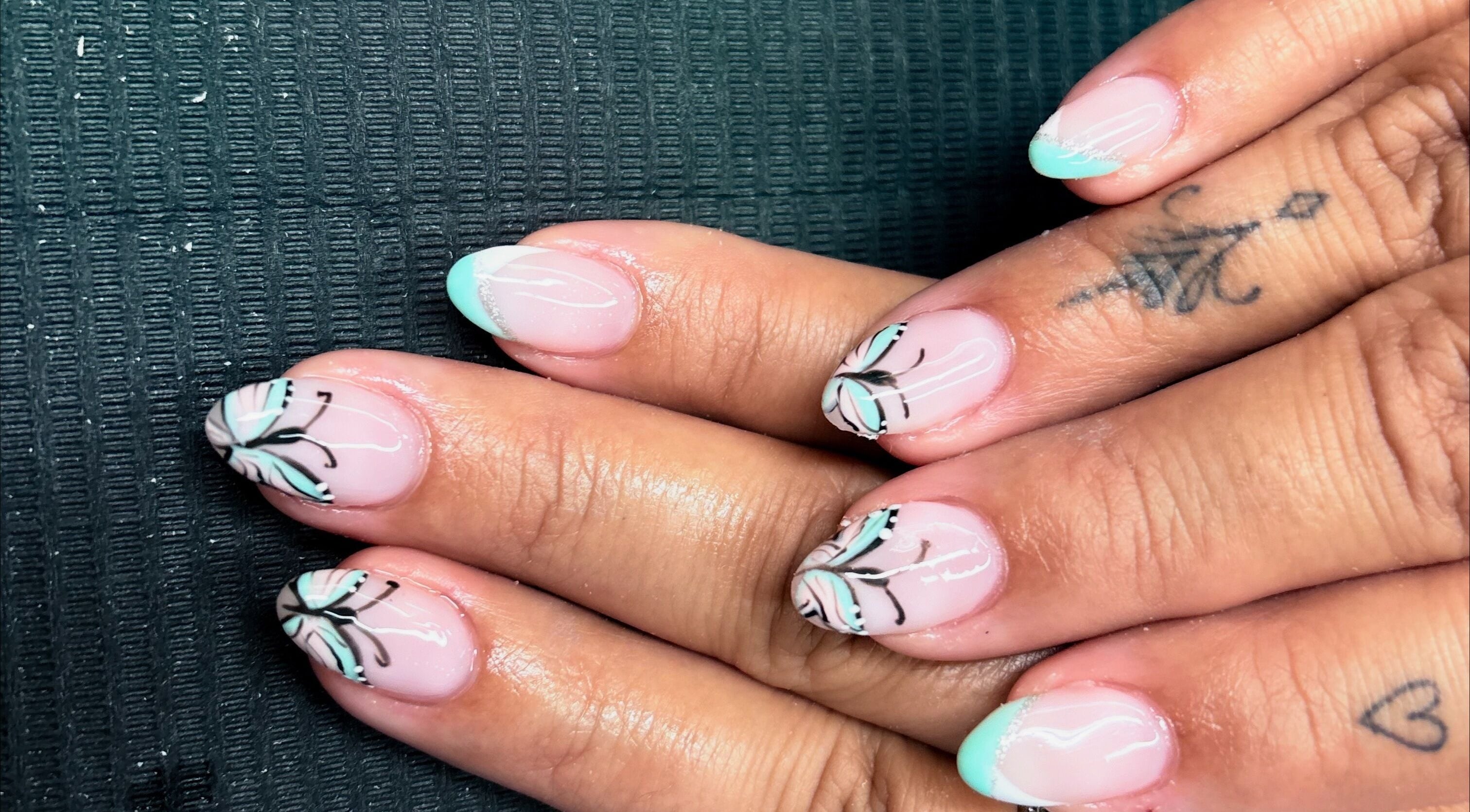Elegant nail art with butterfly design at Mudnmilk nails and beauty, Emanzimtoti, Kwazulu-natal, ZA.