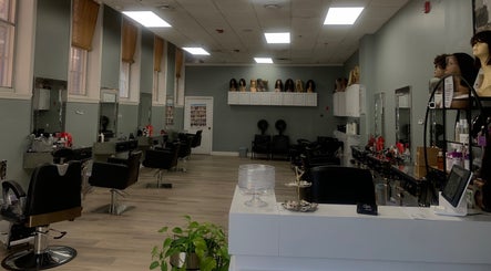 Elegant salon interior at Styles in Haverhill, Massachusetts, US featuring modern styling chairs and decor.