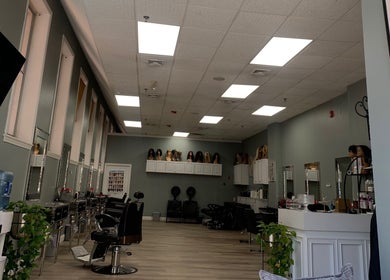 Chic interior of Styles beauty salon in Haverhill, Massachusetts, US with modern styling chairs and mirrors.