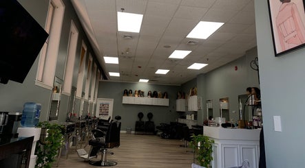 Chic interior of Styles beauty salon in Haverhill, Massachusetts, US with modern styling chairs and mirrors.