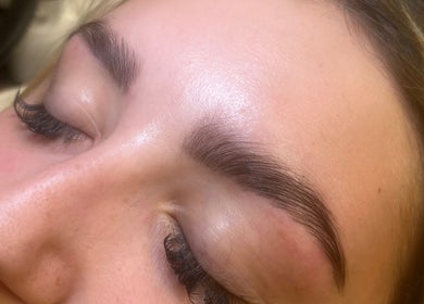 Close-up of perfected eyelashes and eyebrows at Beauty Pod by Ell, Middlesbrough, England, GB.