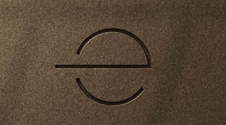 Textured logo design on brown background at Ella Foss - Massage Therapist in Vale, GG.