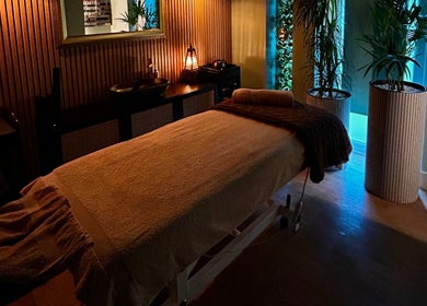 Tranquil massage room at Ella Foss - Massage Therapist, Vale, GG, with soothing lighting and elegant decor.