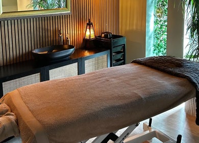 Relaxing massage room at Ella Foss - Massage Therapist, Vale, GG. Cozy ambiance with soft lighting.