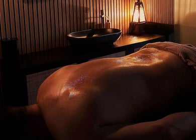 Relaxing massage at Ella Foss - Massage Therapist in Vale, GG with warm ambient lighting.