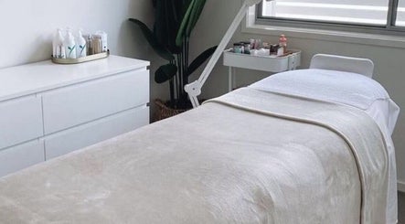 Relaxing treatment room at Browcandylondon, Milton Keynes, England, GB, featuring a cozy bed and elegant decor.