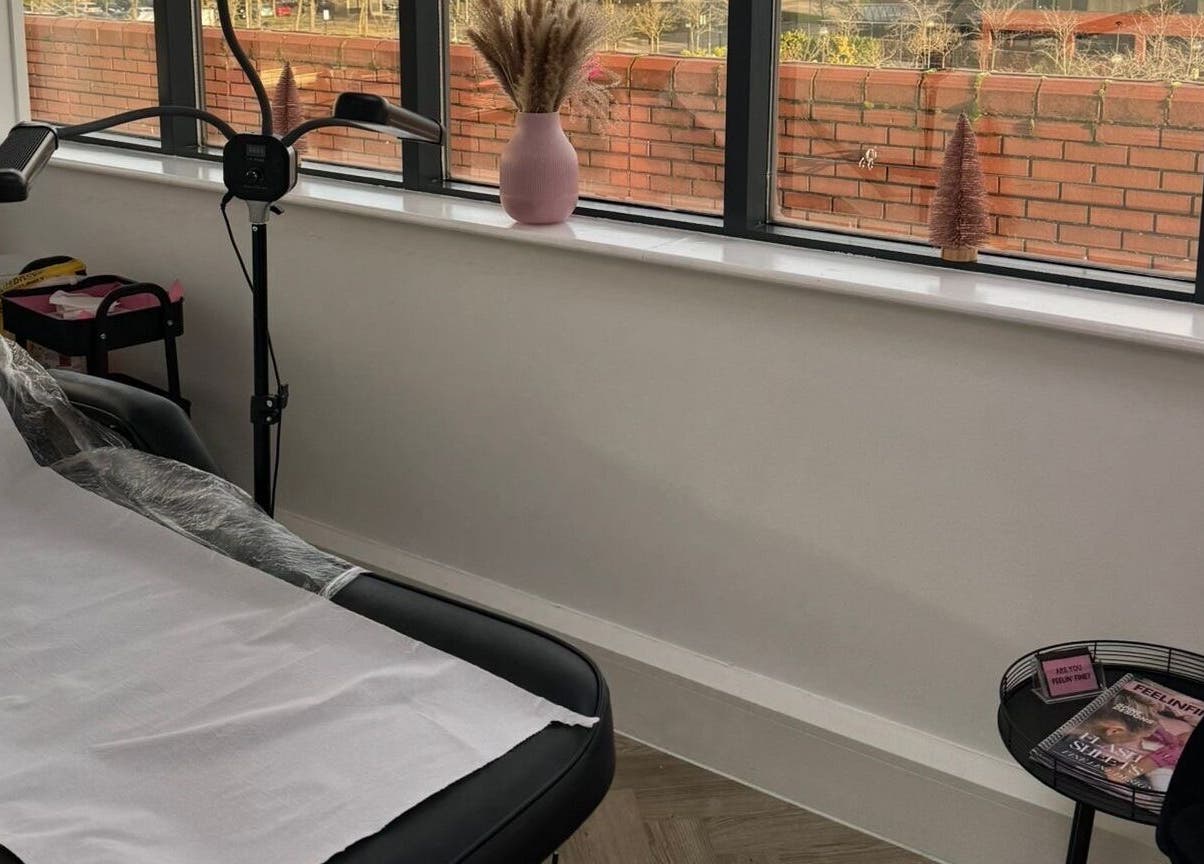 Cozy treatment room at Browed by Min, Milton Keynes, England, GB with a bed, soft lighting, and decor.