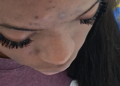 Close-up of styled lashes at Ria's Braids and Beauty, Arima, Arima, TT, showcasing expert beauty techniques.