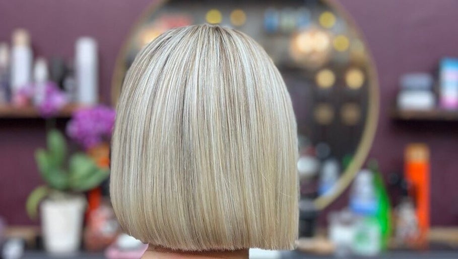 Blonde bob haircut at Persepolis Unisex Salon, London, England, GB with stylish salon decor.