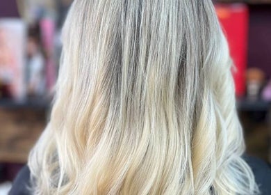 Blonde hair styled with soft waves at Persepolis Unisex Salon, London, England, GB.