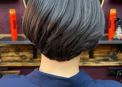Sleek bob haircut at Persepolis Unisex Salon, London, England, GB creating a modern, polished look.