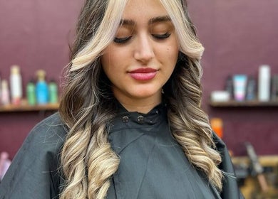 Professional hair highlight at Persepolis Unisex Salon, London, England, GB enhancing glamorous waves.