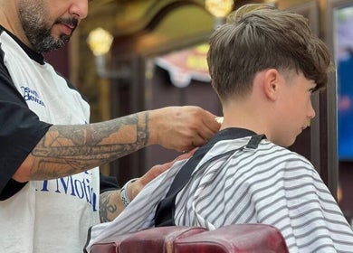 Professional haircut at Persepolis Unisex Salon, London, England, GB. Featuring skilled barber and client interaction.