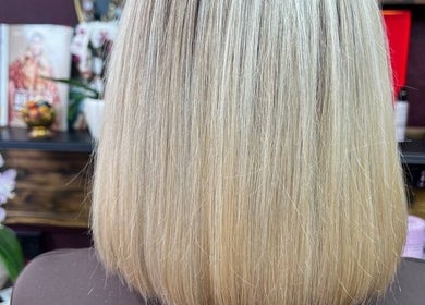 Blonde bob hairstyle showcased at Persepolis Unisex Salon, London, England, GB.