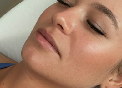 Close-up of a woman with closed eyes receiving eyelash treatment at Ashley’s Lash Lounge & Boutique, Winter Garden, Florida, US.