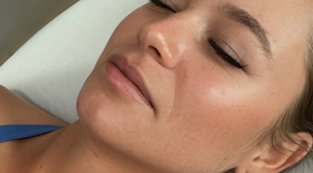 Close-up of a woman with closed eyes receiving eyelash treatment at Ashley’s Lash Lounge & Boutique, Winter Garden, Florida, US.