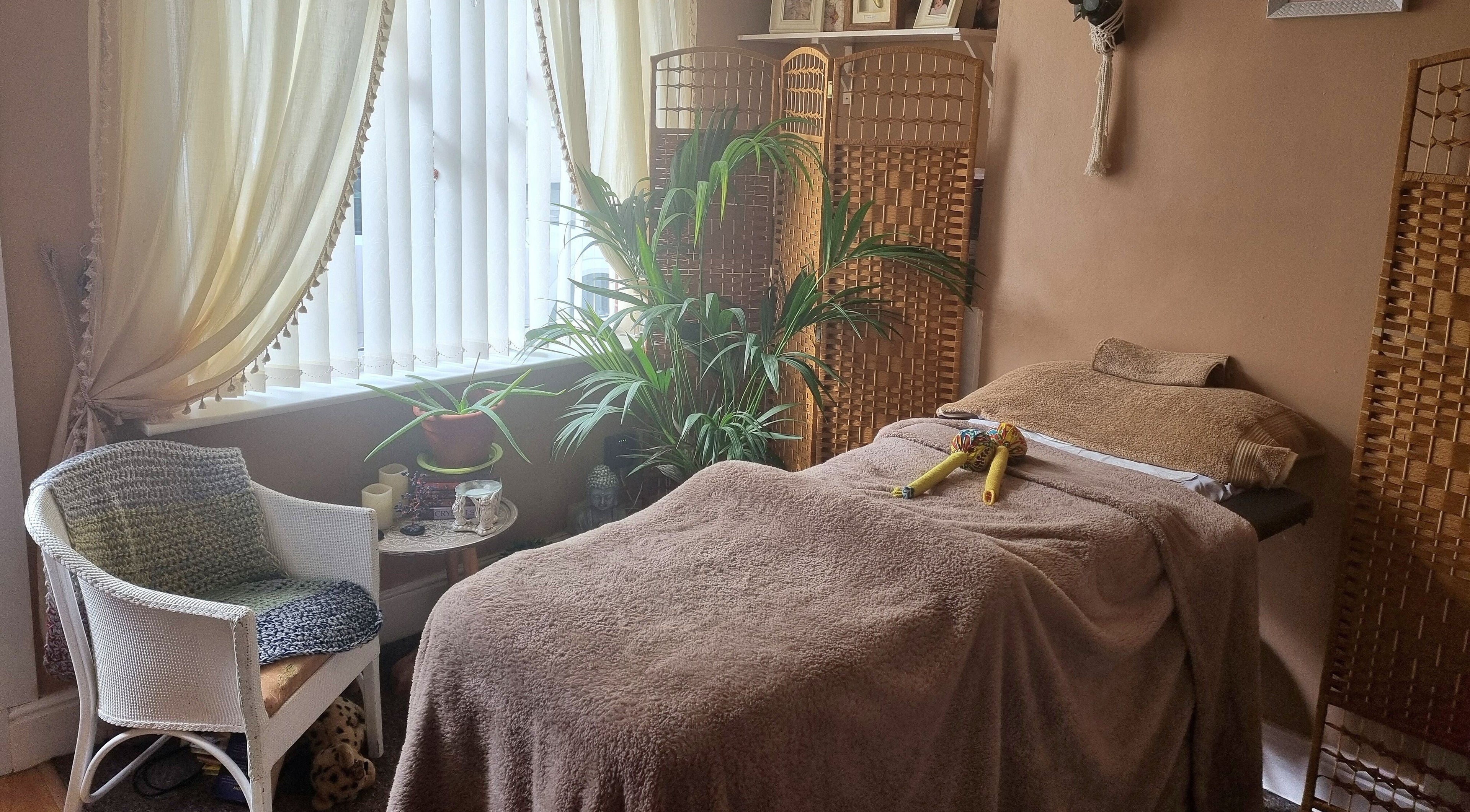 Relaxing massage room at Moon&Rubies, Leicester, England, GB with cozy decor and soft lighting.